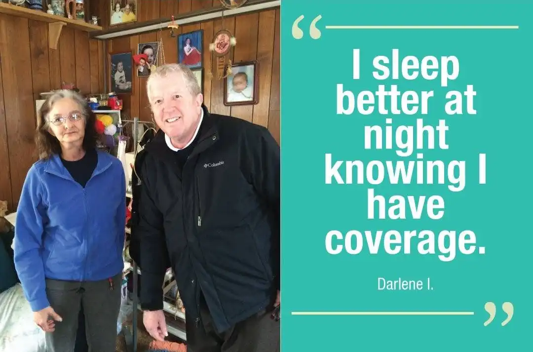 elderly woman with a health navigator discussing her health insurance options