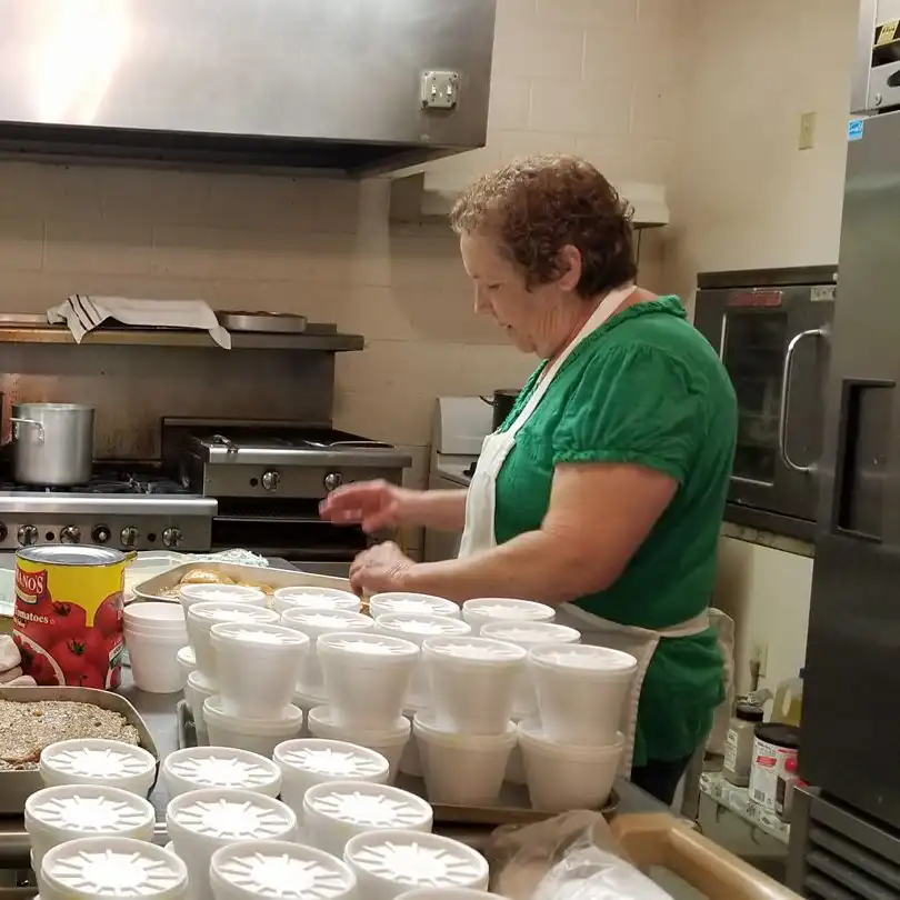 Woman volunteering in the kitchen for Americorps RSVP Oklahoma