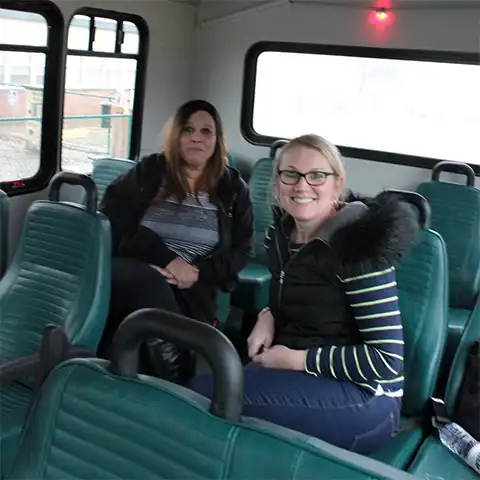 Women riding in a JAMM Transit bus