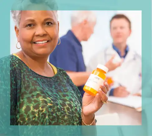An elderly woman holding a bottle of prescription medication