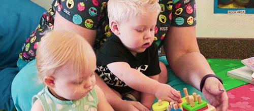 toddlers learning how to play together