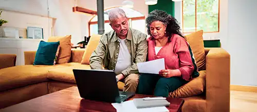 senior couple reviewing their health insurance options